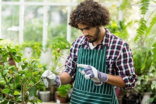 Landscape maintenance worker in Hainault representing ethical labour practices