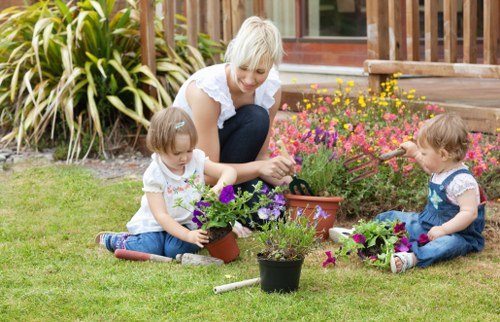 Local lawn mowing team working on a garden in Hainault