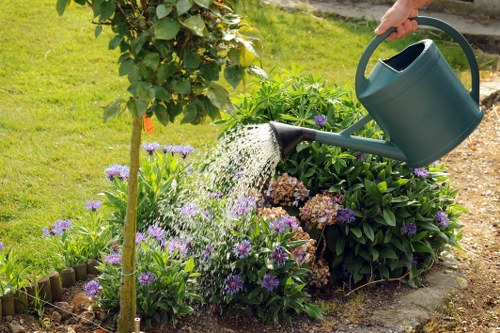 Worker wearing PPE during a Hainault garden clearance