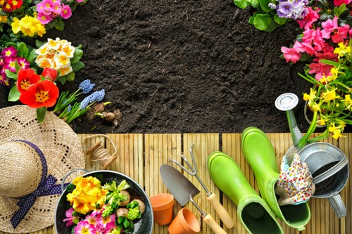 Weed control and clean-up work in a well-maintained Hainault garden